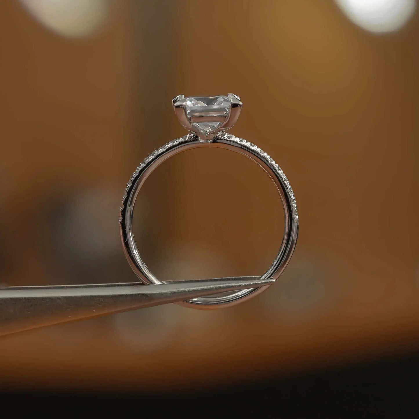 side image in studio luxury princess white gold diamond set shoulders lab grown diamond engagement ring
