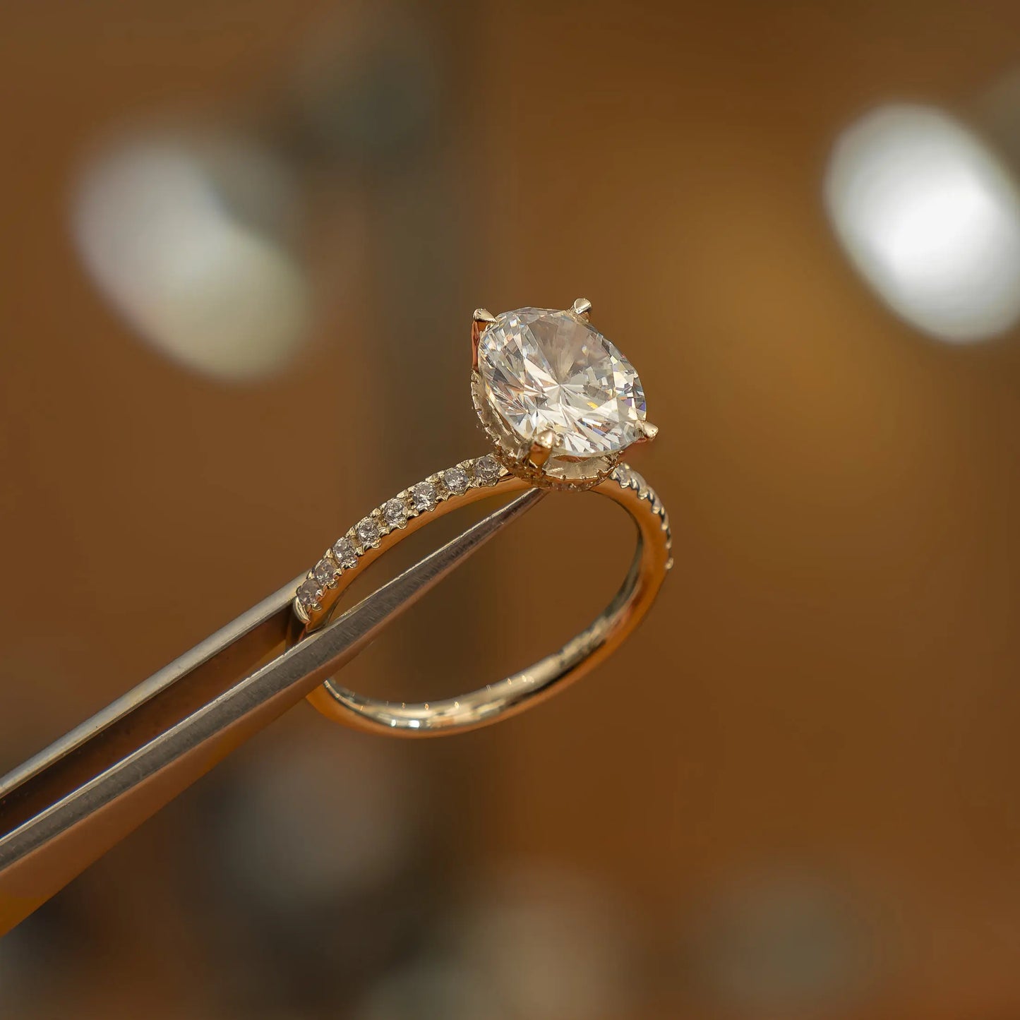 image luxury oval yellow gold diamond set shoulders hidden halo lab grown diamond engagement ring