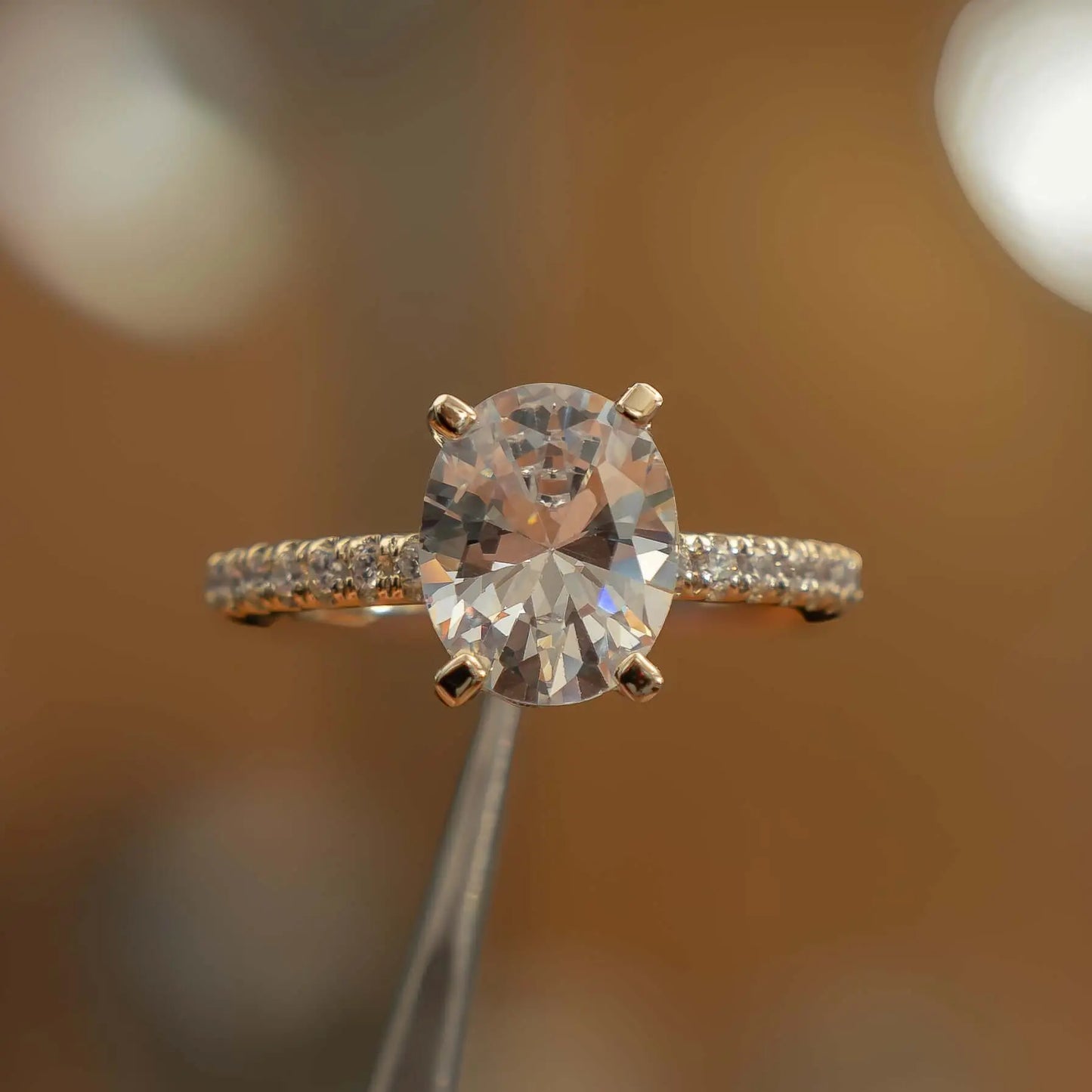 studio image oval yellow gold diamond set shoulders lab grown diamond engagement ring