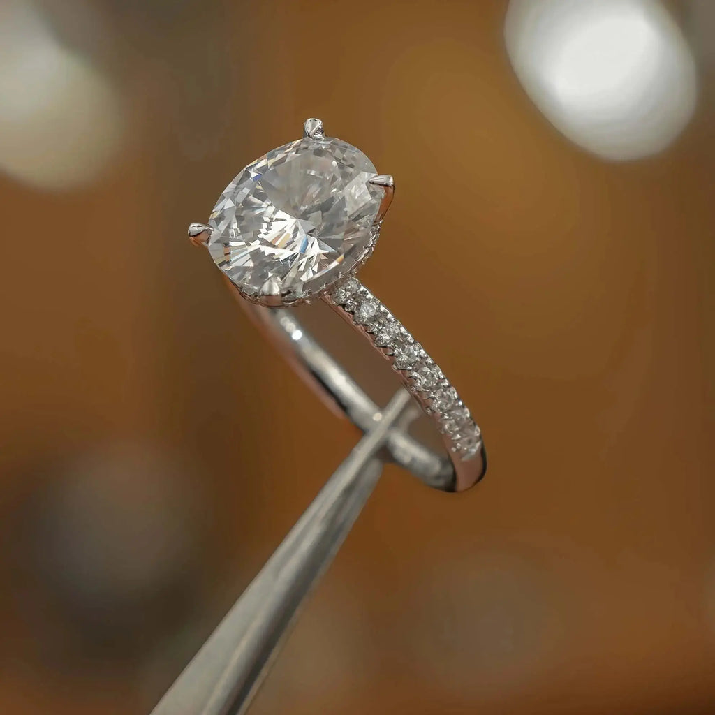 image of luxury oval platinum diamond set shoulders hidden halo lab grown diamond engagement ring