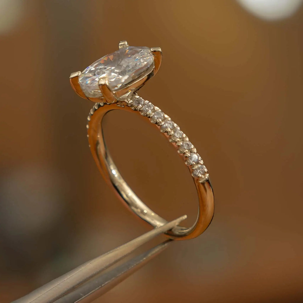 right side view oval yellow gold diamond set shoulders lab grown diamond engagement ring