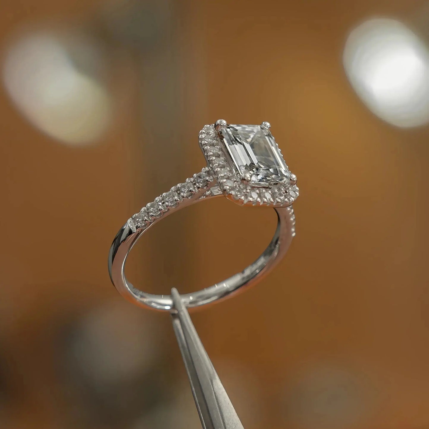 side view luxury emerald white gold diamond halo lab grown diamond engagement ring in studio