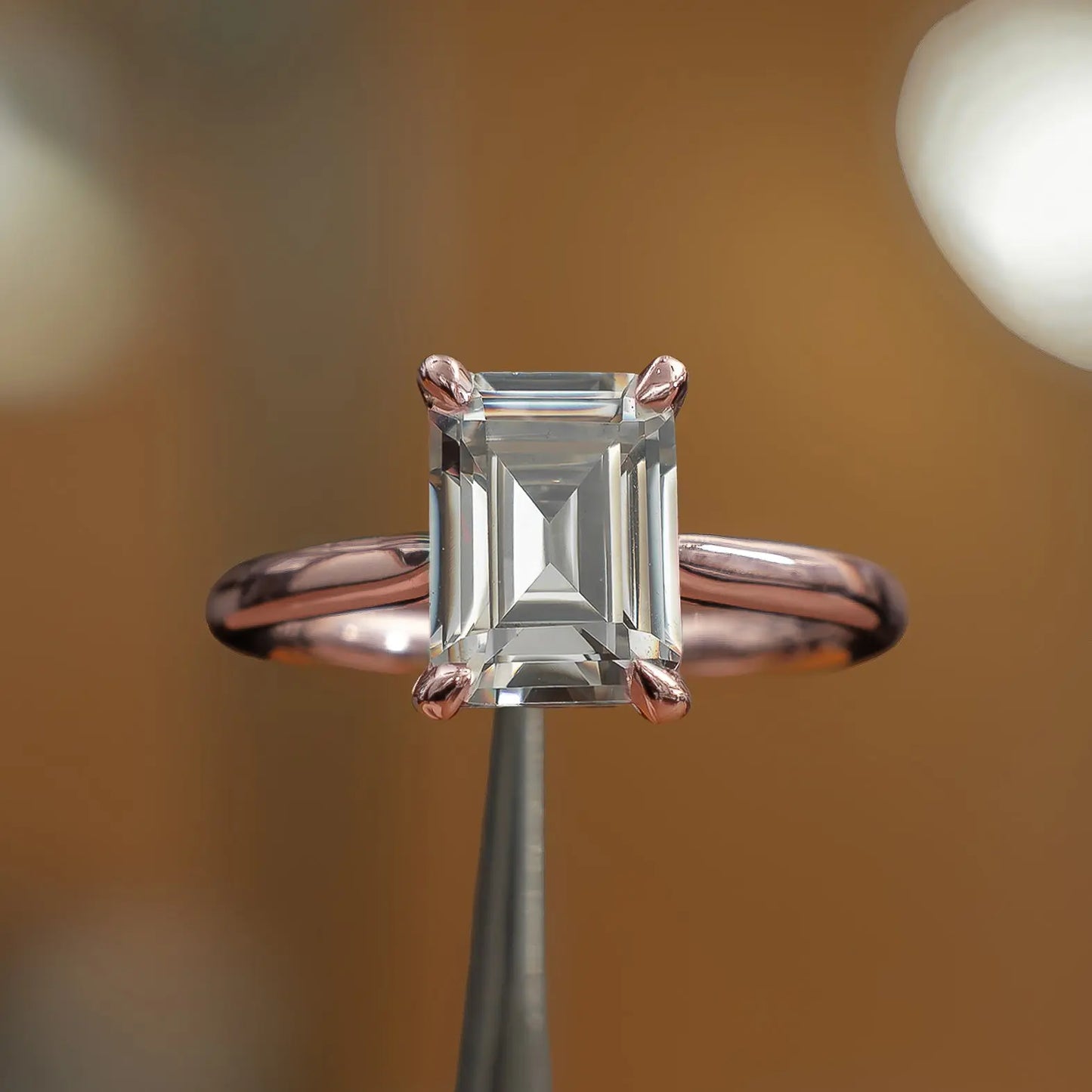 frontal view of luxury emerald rose gold solitaire lab grown diamond engagement ring