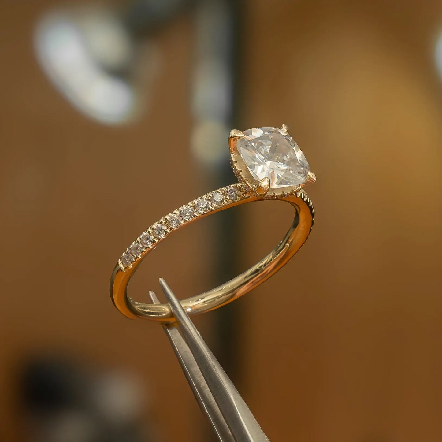 left side view luxury cushion yellow gold diamond set shoulders hidden halo lab grown diamond engagement ring