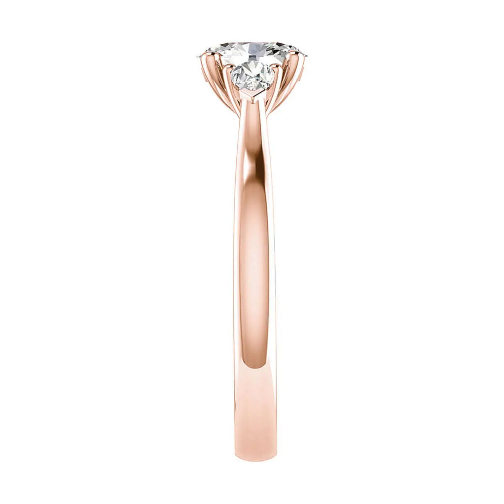 side angle luxury rose gold diamond trilogy round lab grown diamond engagement ring