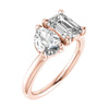 side view emerald and pear rose gold lab grown diamond pair engagement ring