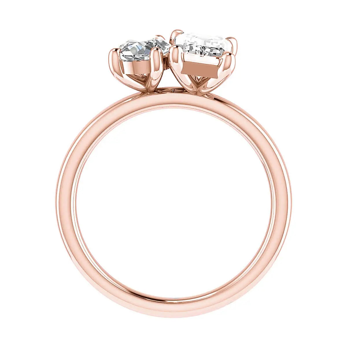 side view luxury emerald and pear rose gold lab grown diamond pair engagement ring