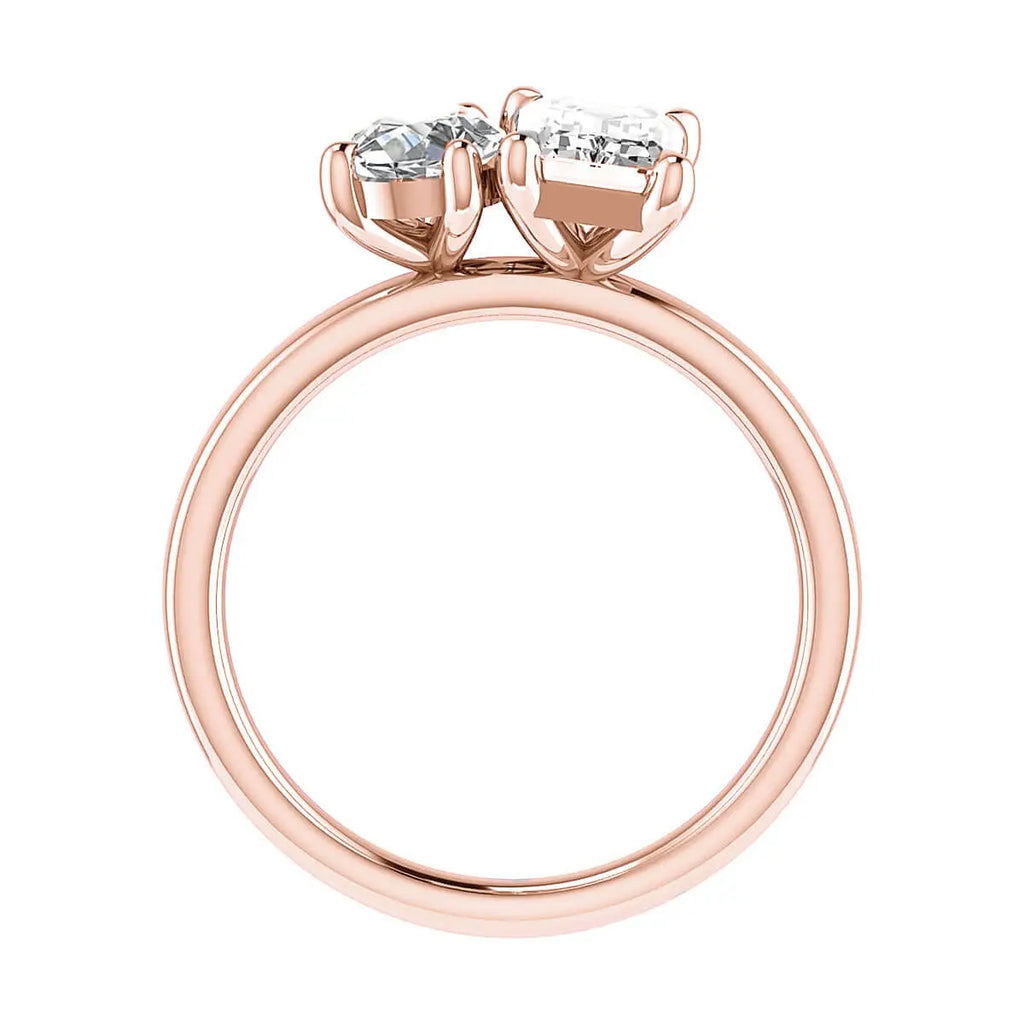 side view luxury emerald and pear rose gold lab grown diamond pair engagement ring