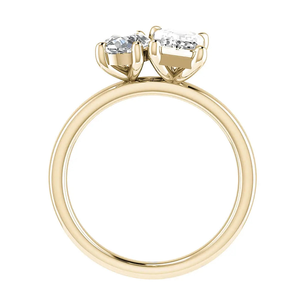 side view luxury emerald and pear yellow gold lab grown diamond pair engagement ring