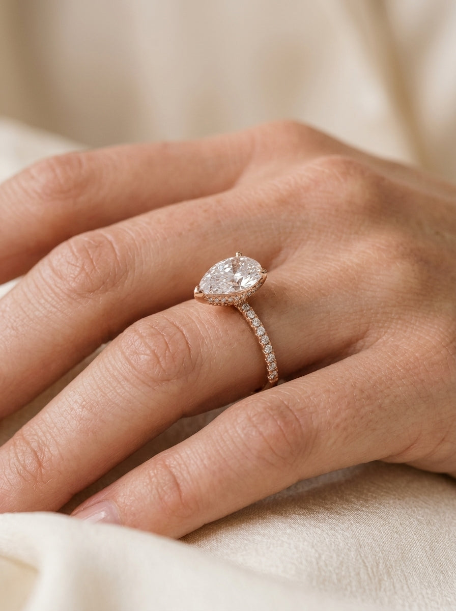Pear-cut solitaire engagement ring — Luxury Bridal Jewelry Close-up | Generated by Modelize