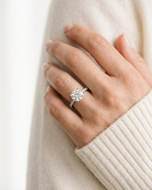 Solitaire engagement ring with pavé band — Luxury Bridal Jewelry Close-up | Generated by Modelize